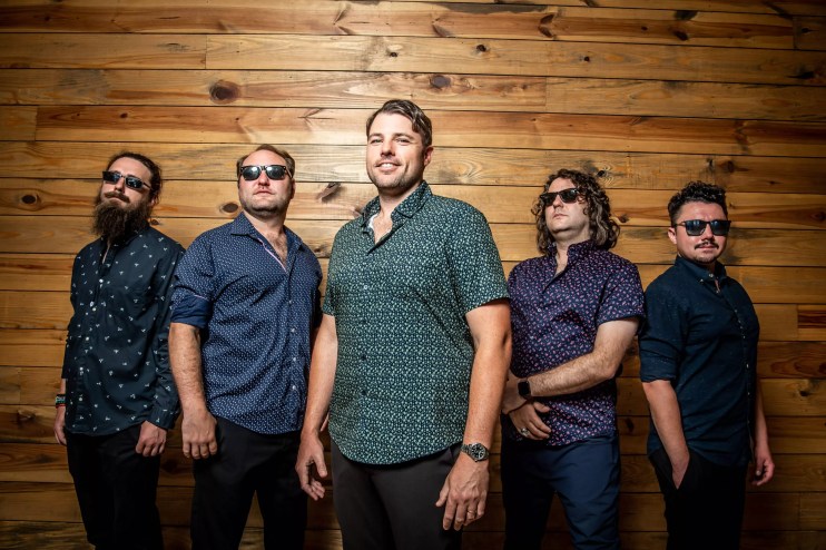 Band is posing for a picture