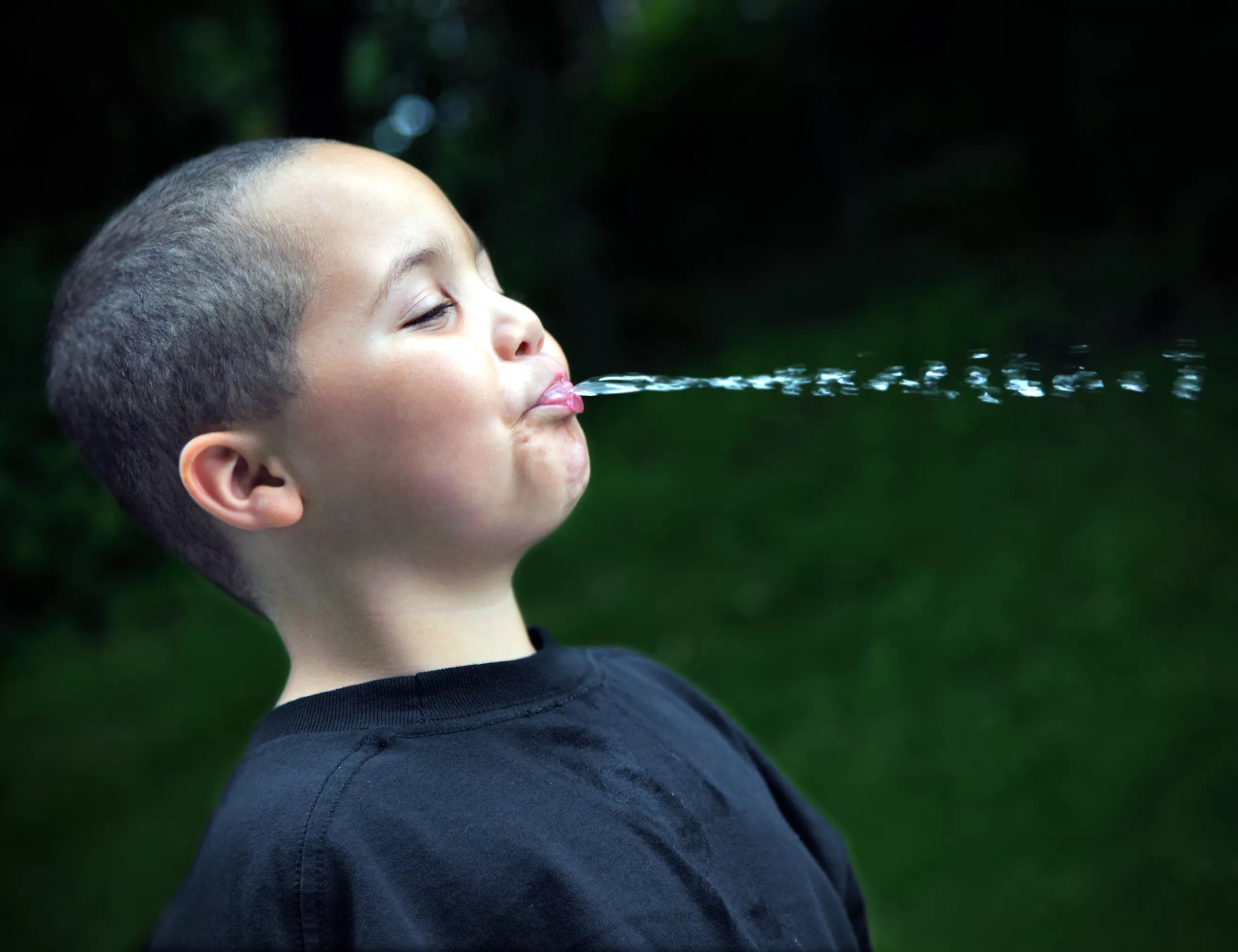 a kid spitting