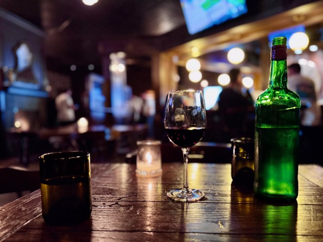 wine on a table at a bar.